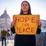 u-s-catholic-woman-with-sign-hope-for-peace
